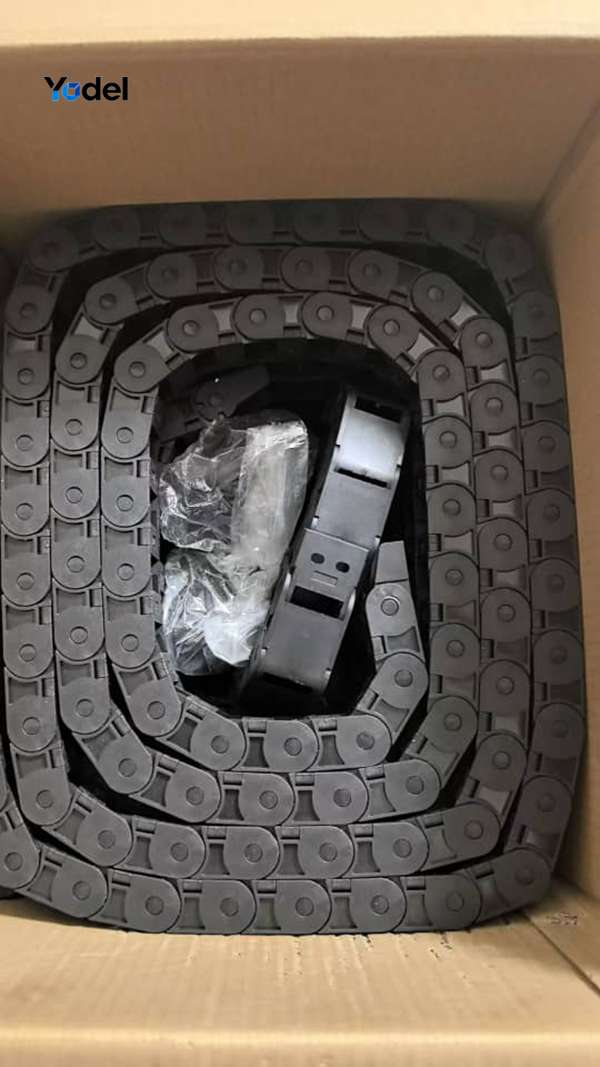 Coiled 15x30 side-openable nylon drag chain neatly packed inside corrugated carton