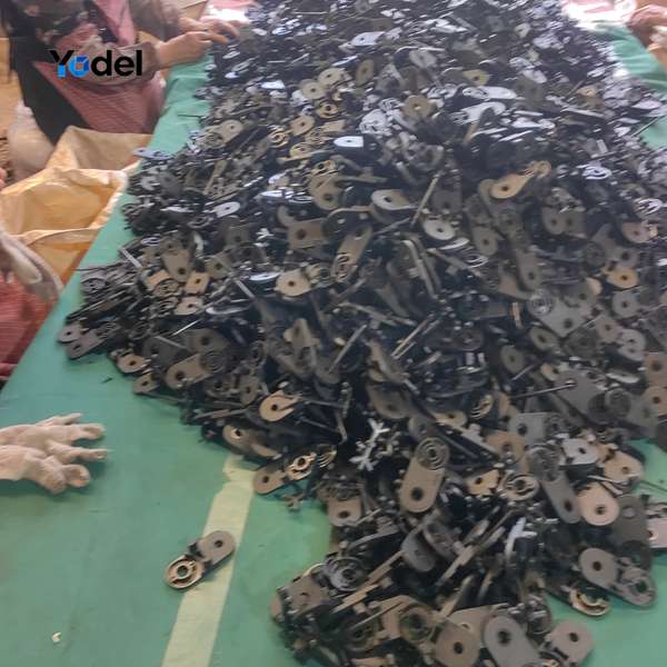 Precision drag chain 18x37 side links and component sorting on assembly table in workshop