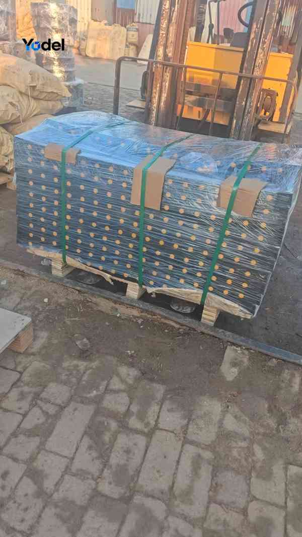 Film wrapped and strapped 35x100 cable drag chain segments stacked on wooden pallet for dispatch