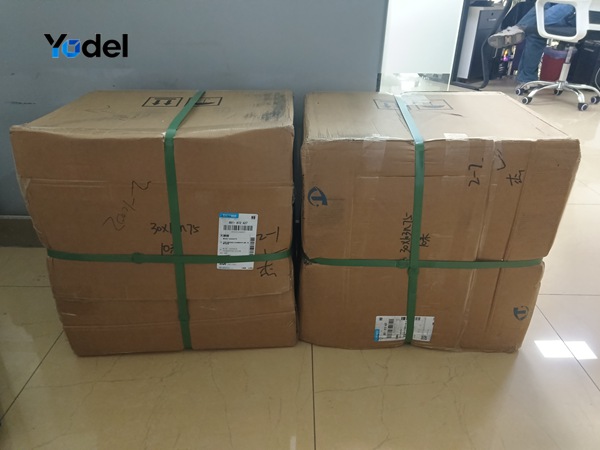 Reinforced corrugated carton packages with strapping for cable track 75x30 ready for pick-up