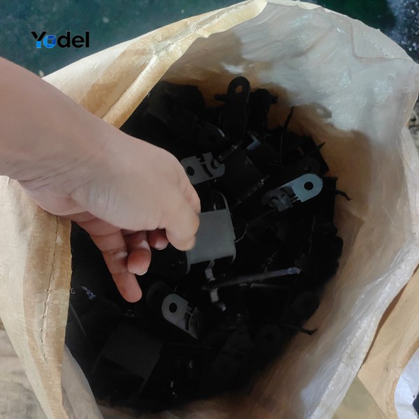 Unassembled nylon cable track 75x30 individual molded links and component parts inside woven bag