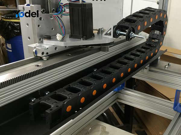 Open bridge drag chain 25x38 installed on linear motion axis of automated machinery for cable guidance