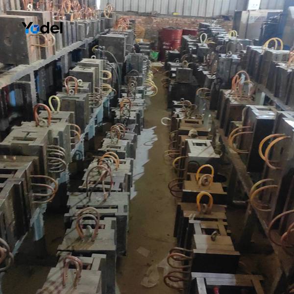 Precision steel injection molds for various sizes of plastic drag chain production stored in factory workshop