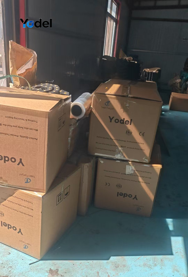 Heavy-duty export corrugated carton boxes stacked in factory warehouse containing cable and hose carrier 80x150 ready for delivery