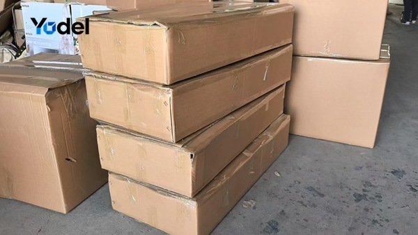 Stacked export carton packaging boxes containing cable & hose carriers 65x125 prepared for worldwide delivery