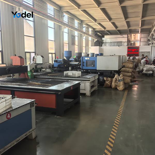 Industrial injection molding machine workshop producing glass fiber reinforced nylon links for CNC drag chain R55 25x75