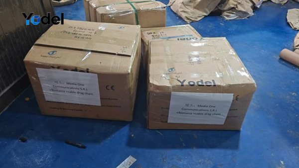 Sealed export shipping cartons containing assembled plastic cable chain 25x38 stock ready for international shipment