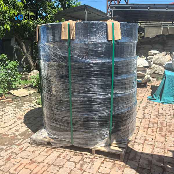 Coiled and stretch-wrapped 55x150 CNC cable carrier bundles secured on pallet for export
