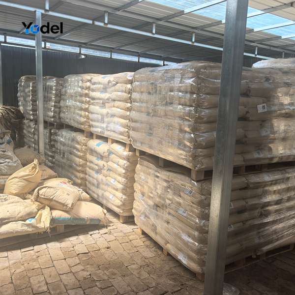 Stacked pallets of 30% glass-fiber reinforced PA66 raw material bags for CNC drag chain manufacturing