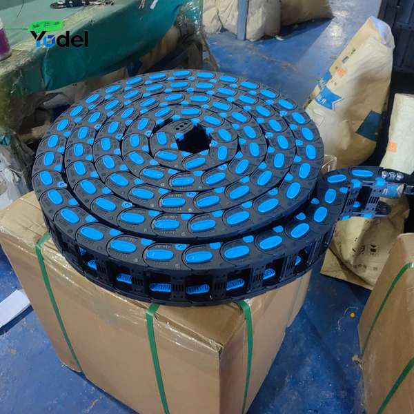 Finished cable carrier system 38x100 with rollers rolled and packaged on cardboard box