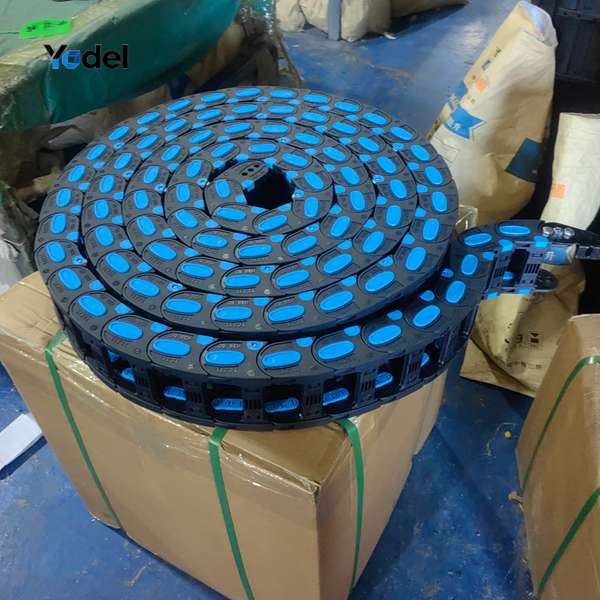 Finished 48x150 cable hose carrier assembly rolled and packaged on cardboard box