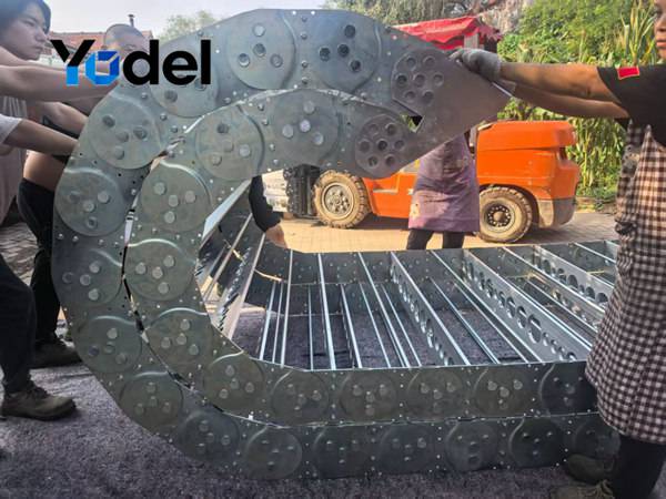 Extra-large custom stainless steel cable carriers with perforated integral hole stays for heavy machinery